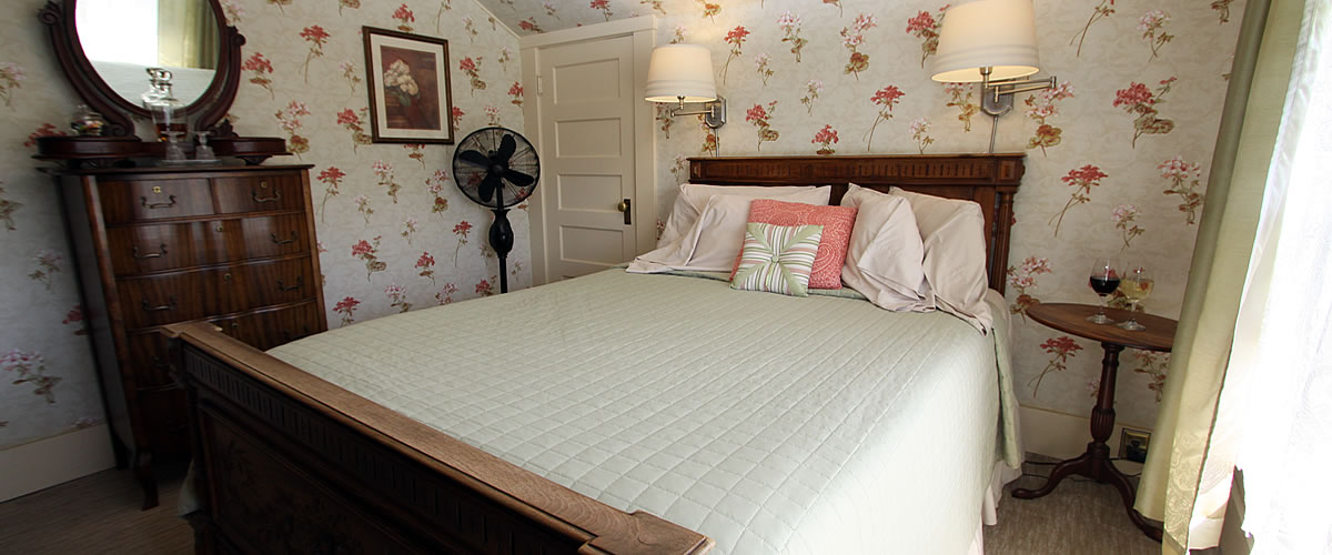 monterey bed and breakfast wabe room with queen bed and dresser