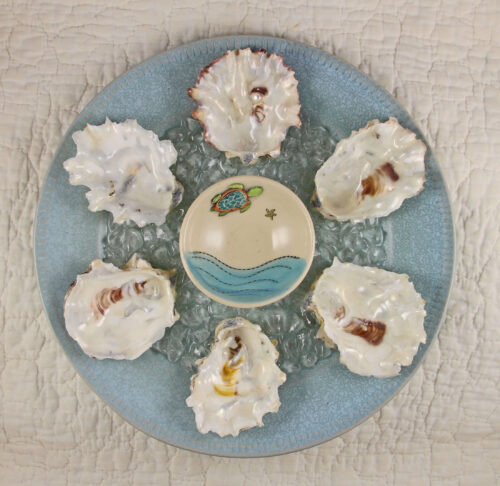 Collectible oyster plates and seashell clocks.