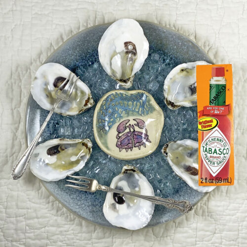 real oyster shell oyster plate with ceramic crab sauce bowl
