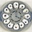 wall clock with 12 oyster shells marking the hours