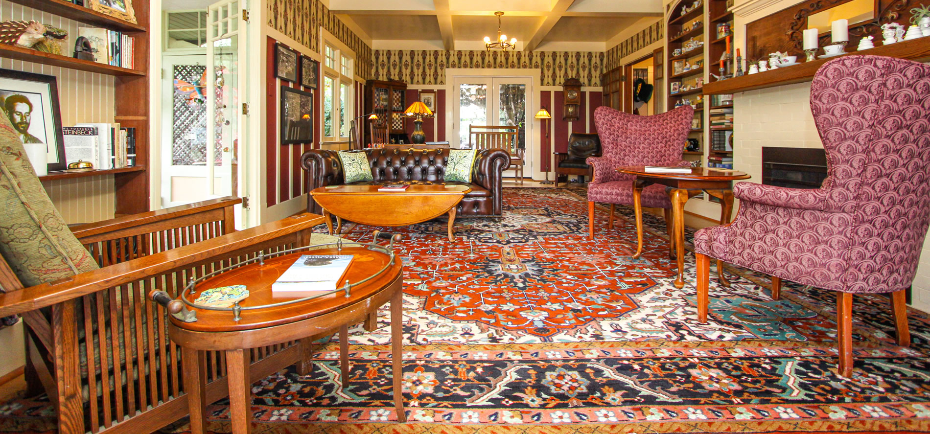 jabberwock inn living room with couch, chairs, tables and fireplace